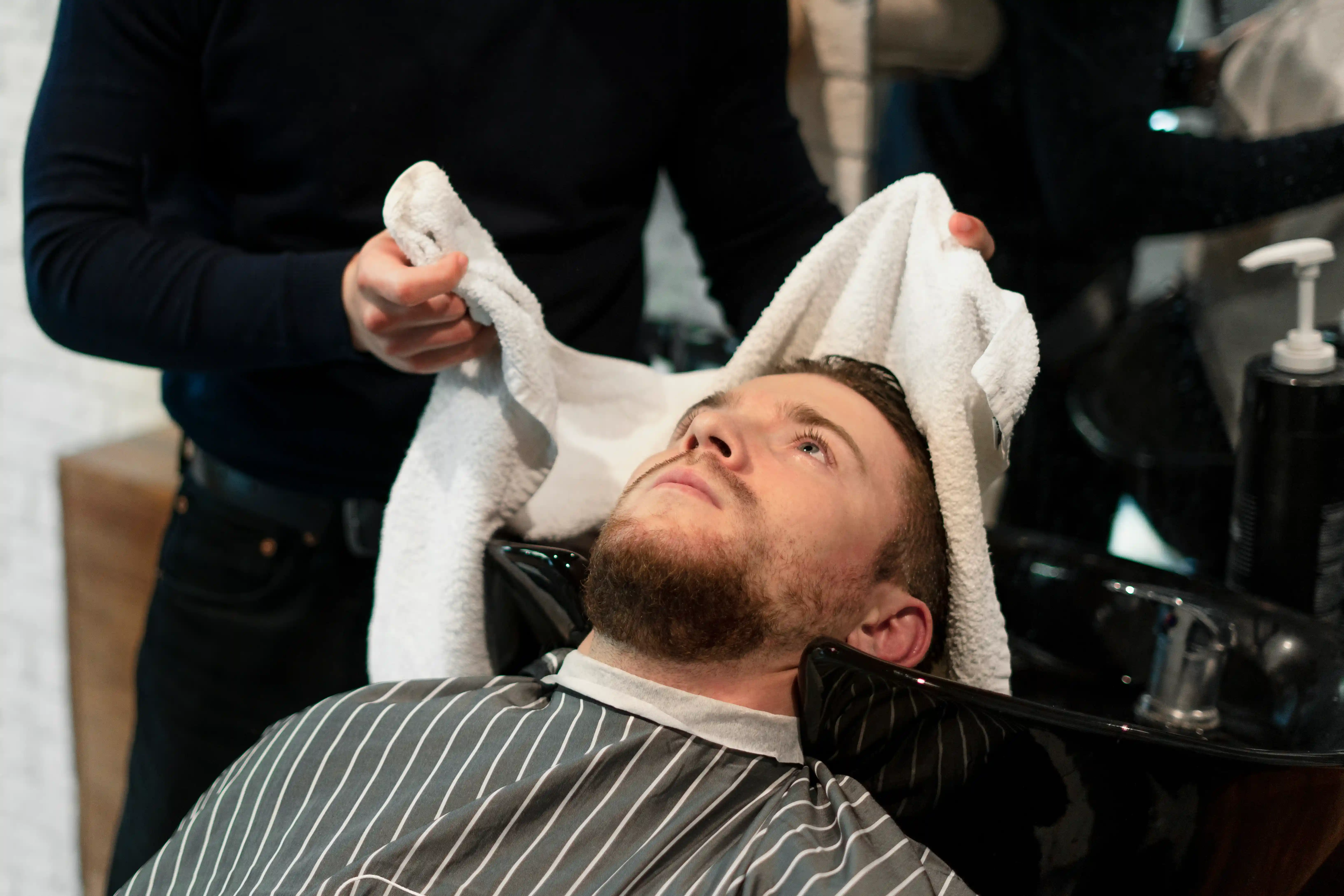 https://www.freepik.com/free-photo/close-up-man-getting-his-hair-washed_21531688.htm